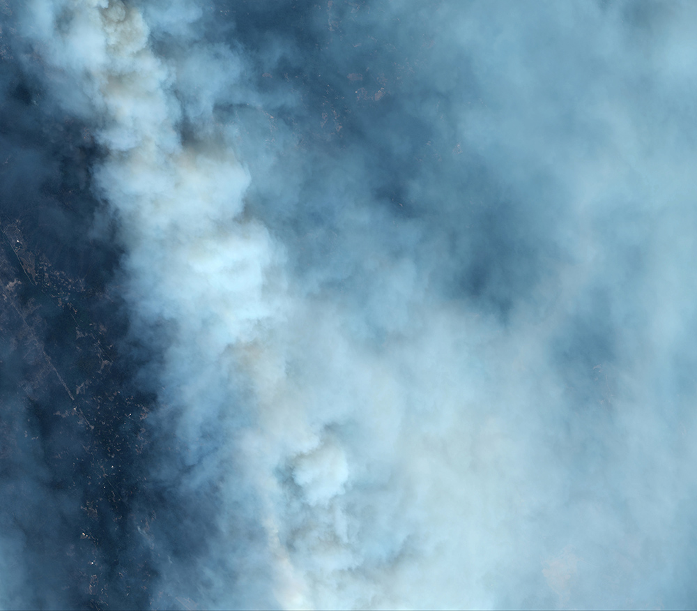 Satellite image shows smoke over Boulder Creek, Calif., from the CZU Lightning Complex fire on Aug. 21, 2020.