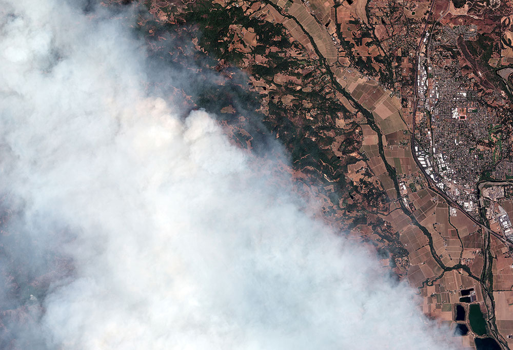 Satellite image shows smoke over Healdsburg, Calif., from the LNU Lightning Complex fire on Aug. 20, 2020.