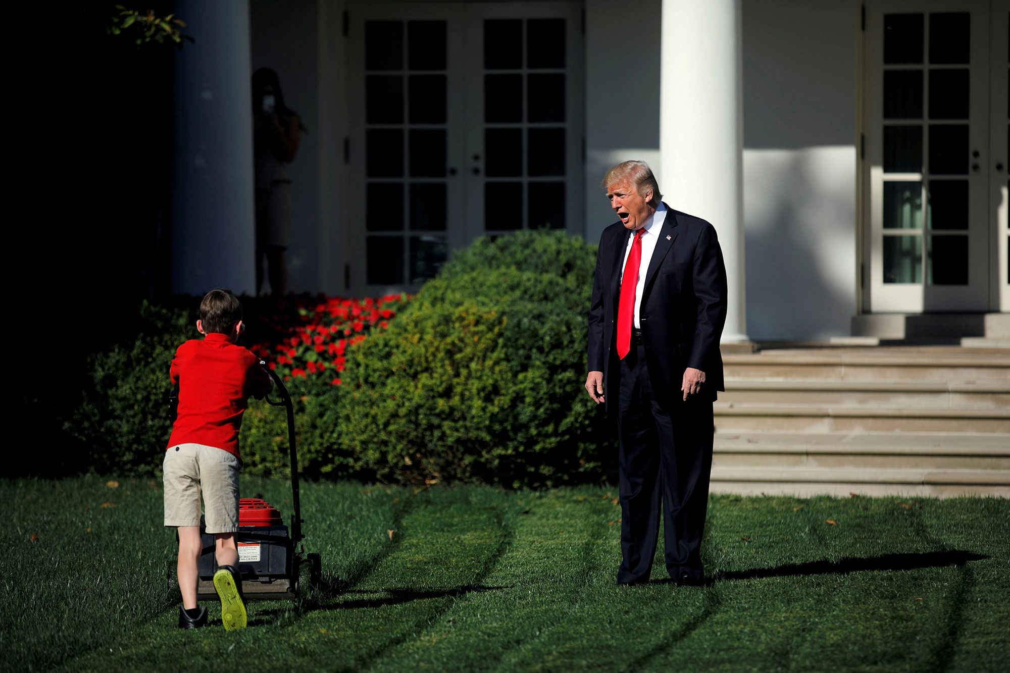 Trump welcomes 11-year-old Frank Giaccio as he mows the lawn in the Rose Garden on Sept. 15, 2017.